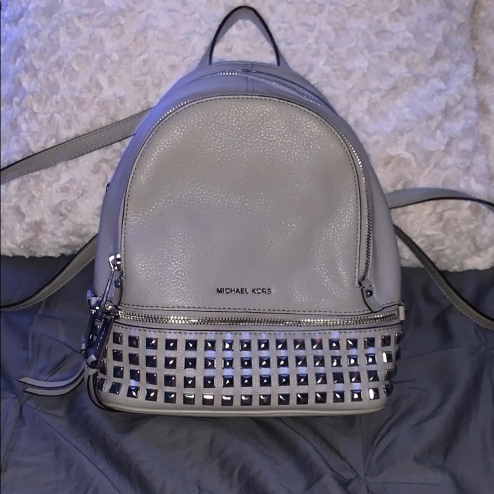 Micheal Kor’s rhea zip pyramid stud backpack